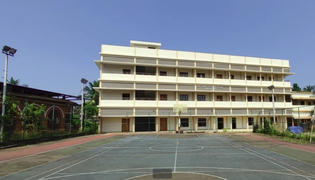 Multi-storey school building beside a sports court