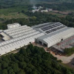 Aerial view of Axtel Industries Shed 2 under construction beside the completed Shed 1, Vadodara, Gujarat