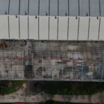 Aerial view of Axtel Industries Shed 2 under construction beside the completed Shed 1, Vadodara, Gujarat
