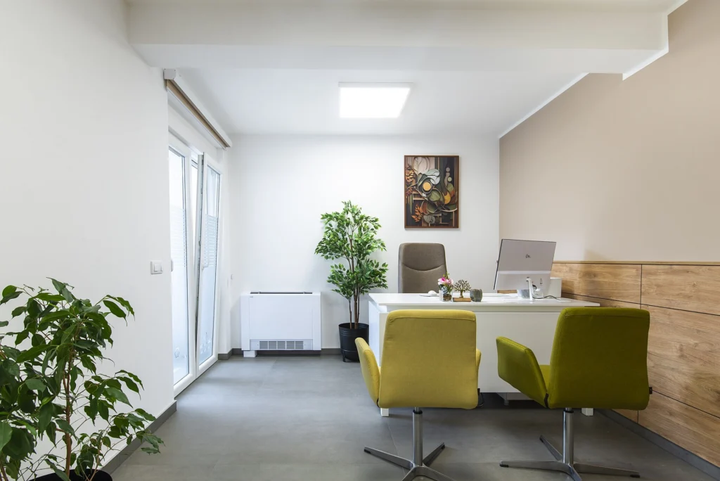 Furnished office cabin with a desk, chairs and storage