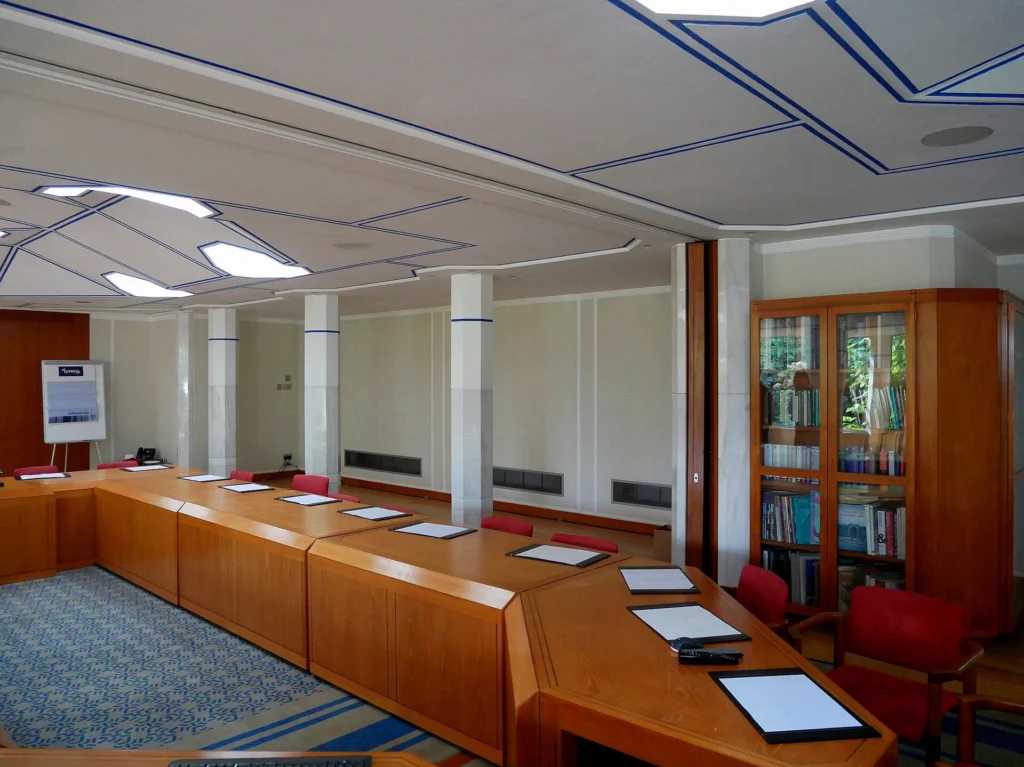 Conference room with fitted timber furniture and storage units